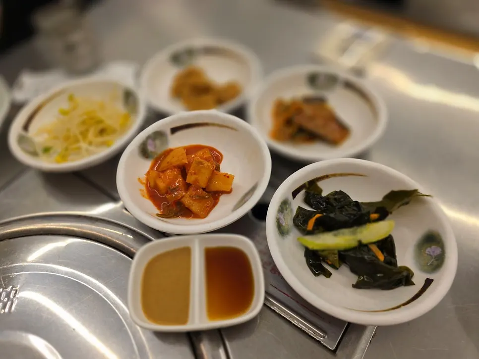 Mom's set for three with grilled fish and stir-fried pork on the table
