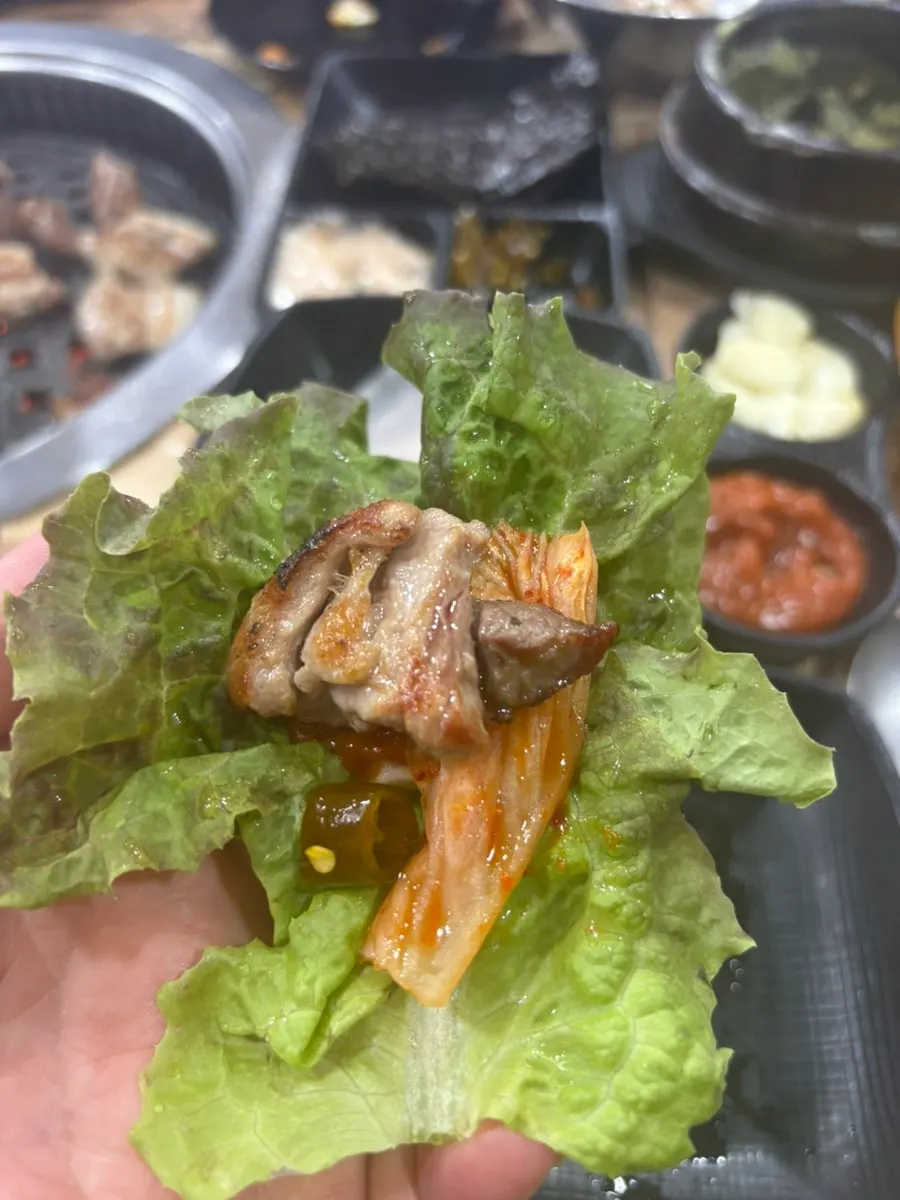 Pork neck and pork skin on the grill