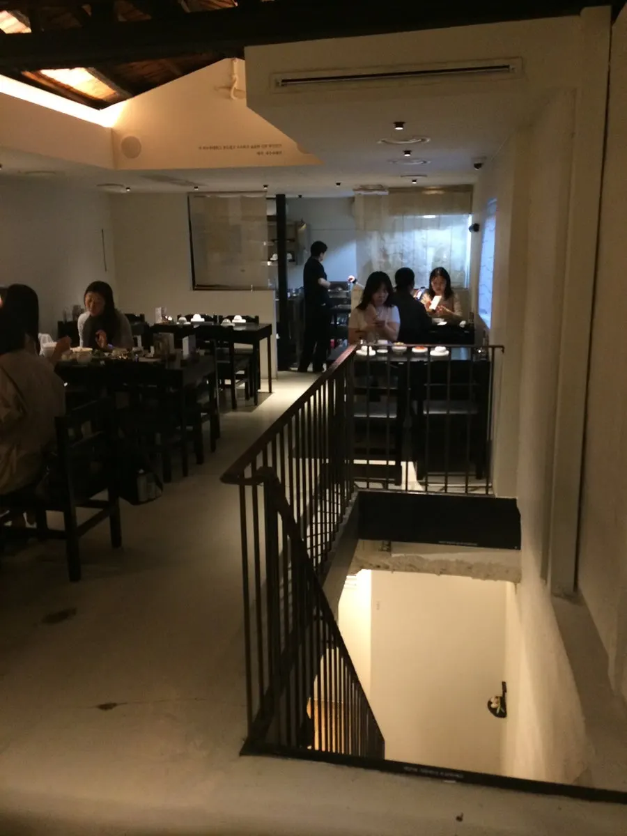 Second-floor table area at Tanbaek