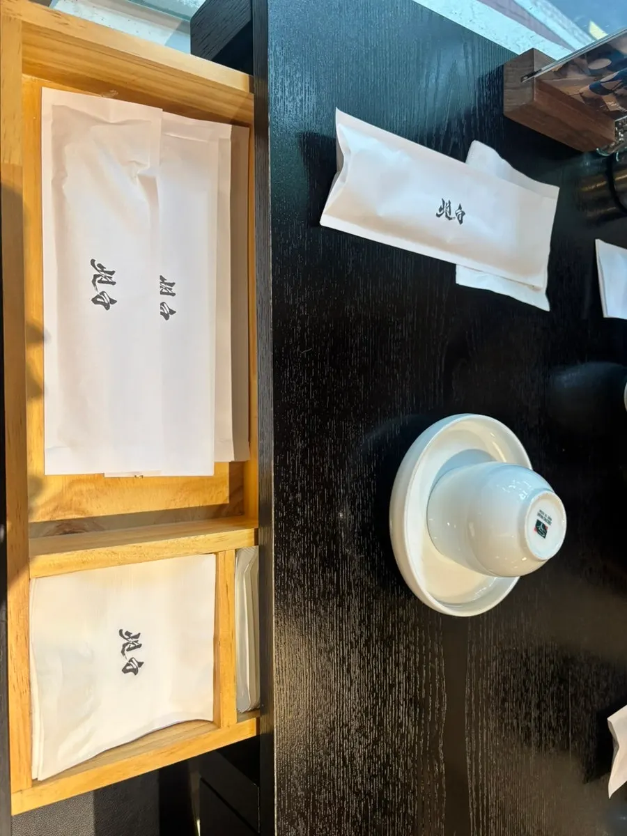 Tableware in the drawer beneath the table