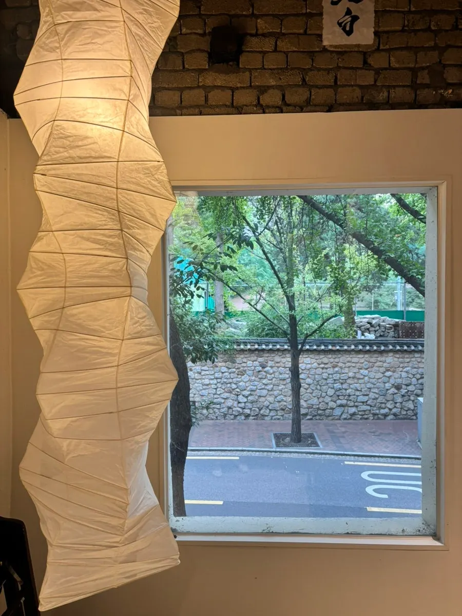 A window seat overlooking trees on Jeongdong-gil