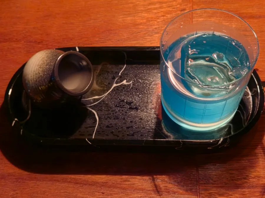 Cocktail being mixed at the bar table