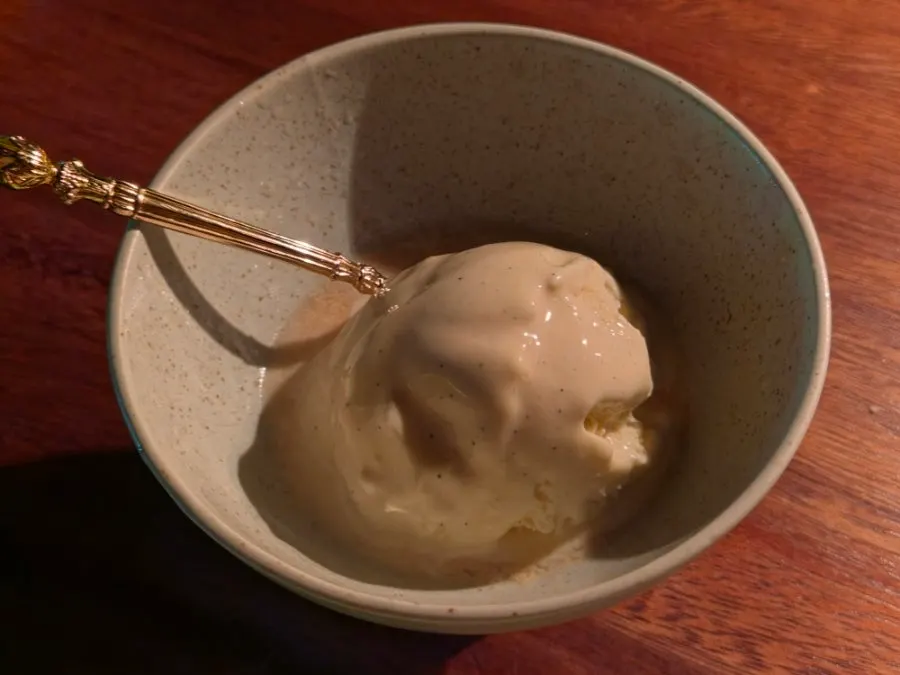 Dessert ice cream set on fire after vodka is poured over it