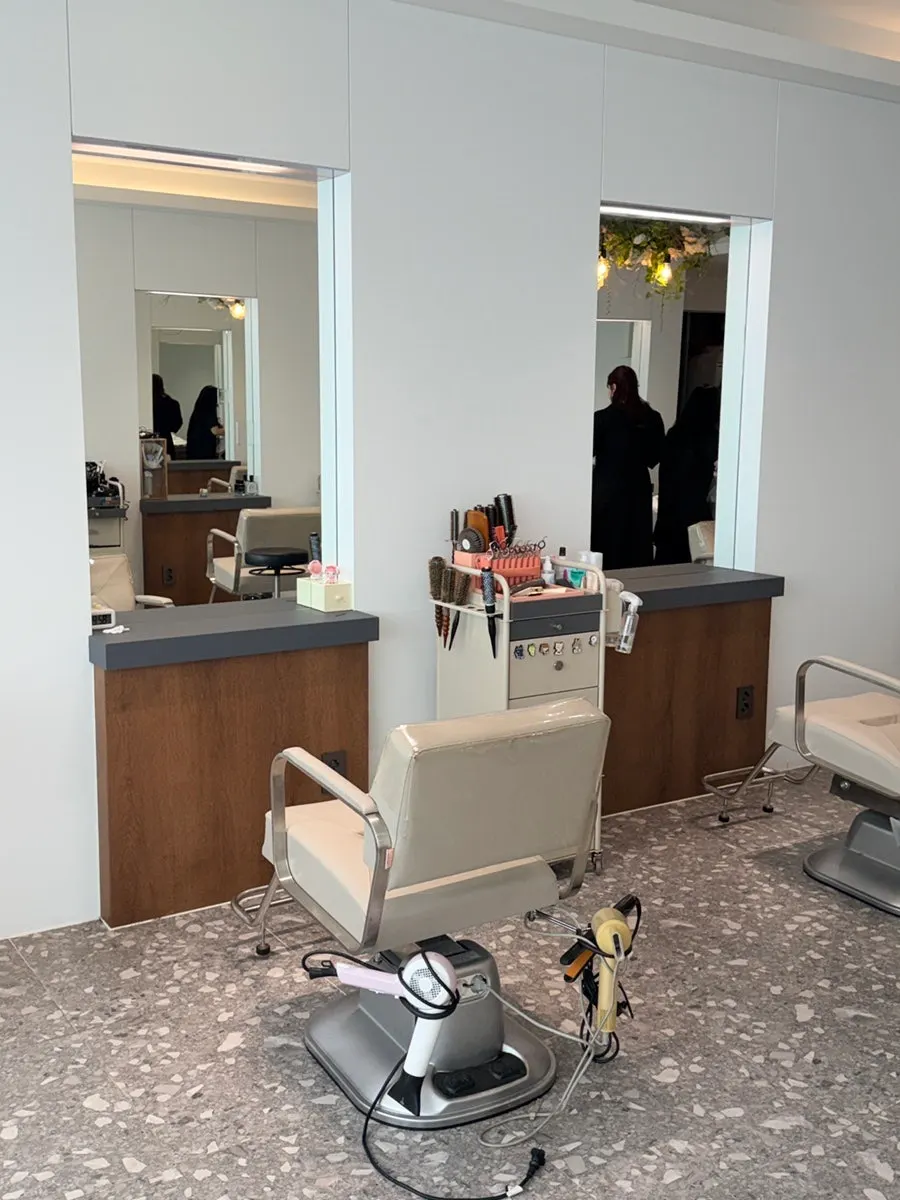 Hair salon in white and wood tones