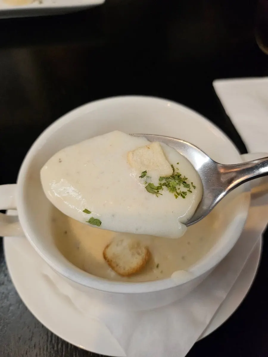 A bowl of warm potato soup