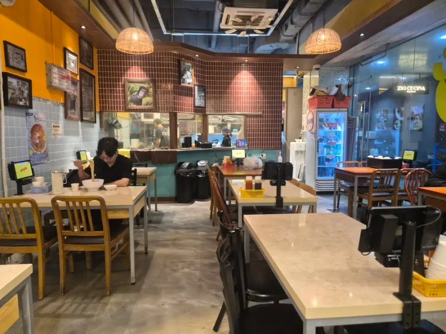 Restaurant interior continuing the Vietnamese atmosphere