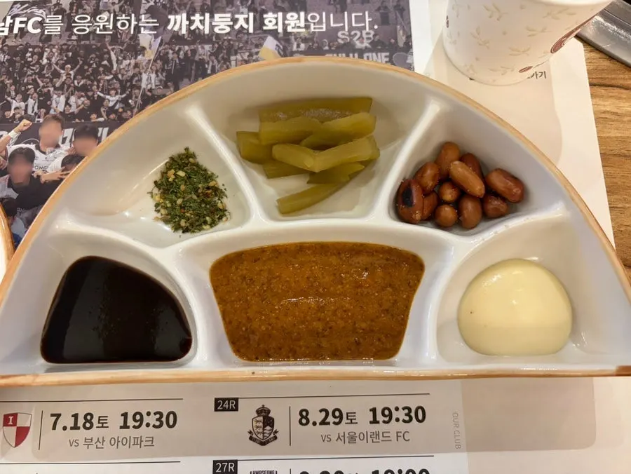 Various sauces served alongside the lamb