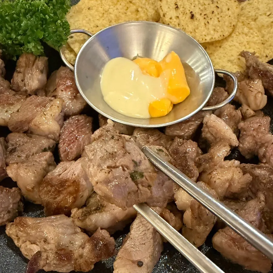 Close-up of grilled lamb ribs cut into bite-sized pieces