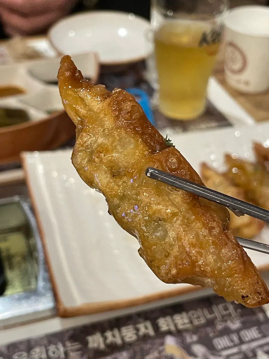 Crispy dumplings coated in a tangy sauce