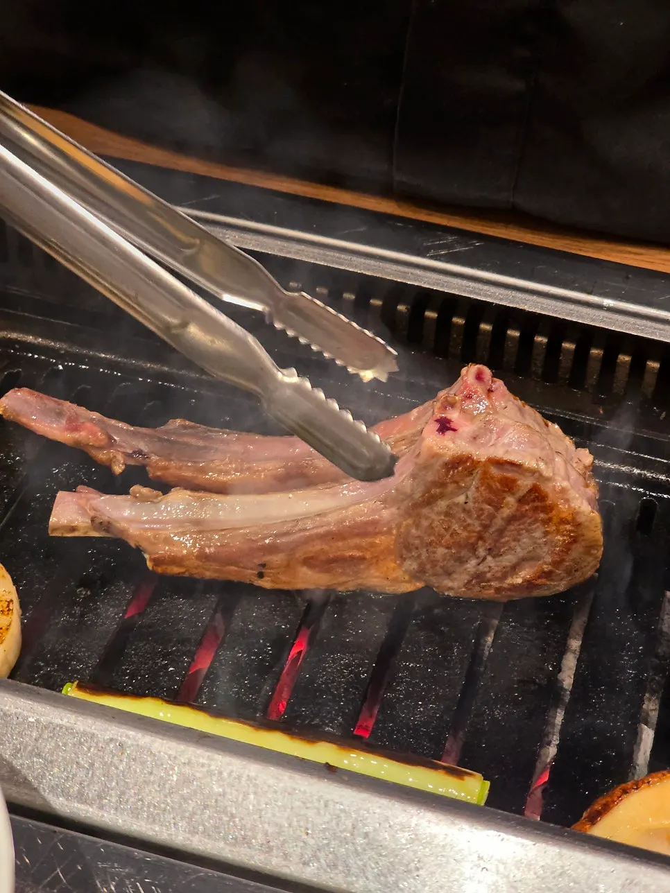 Rested and sliced lamb plated after grilling