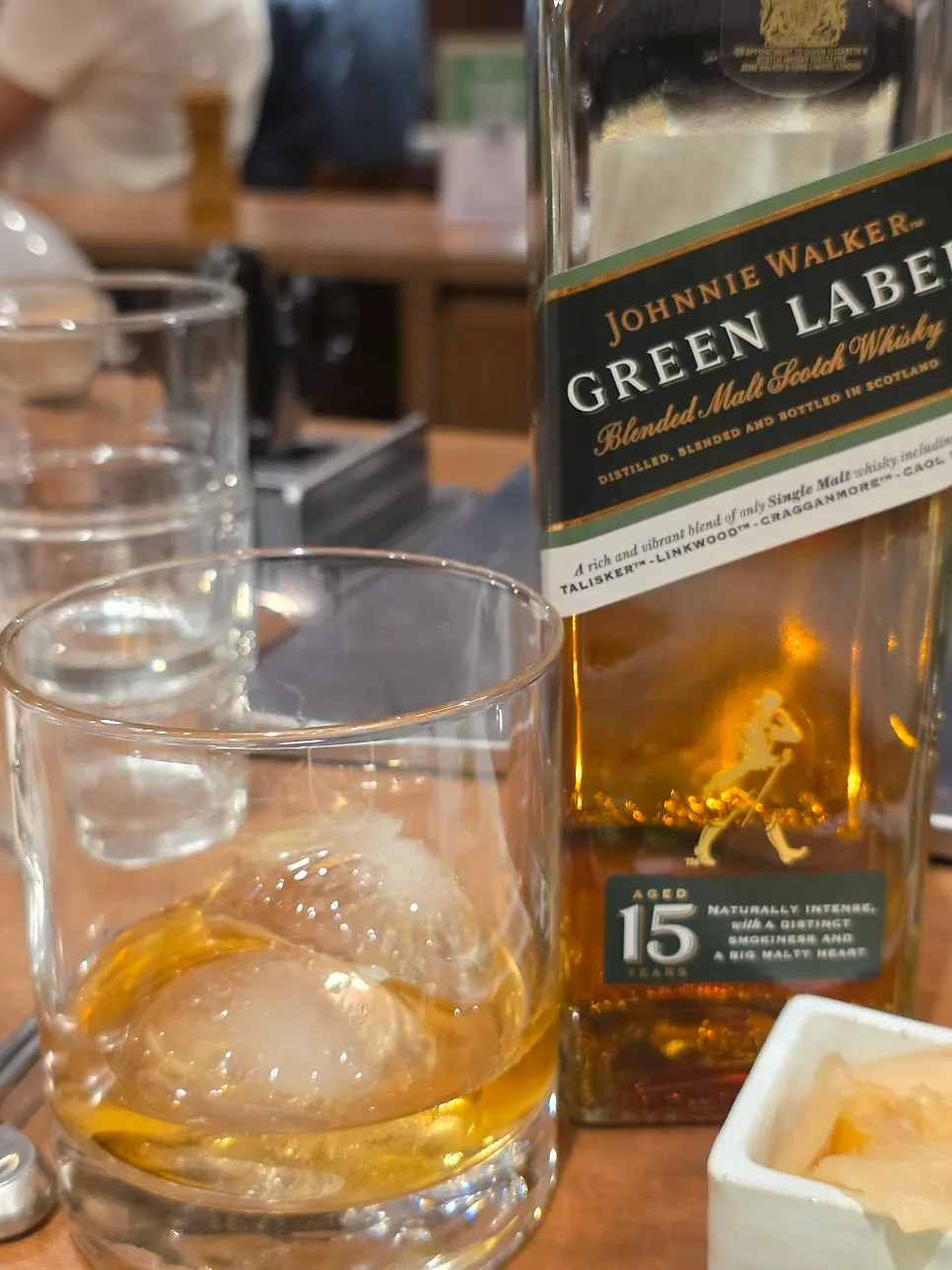 Glass of whiskey on the rocks brought in via corkage