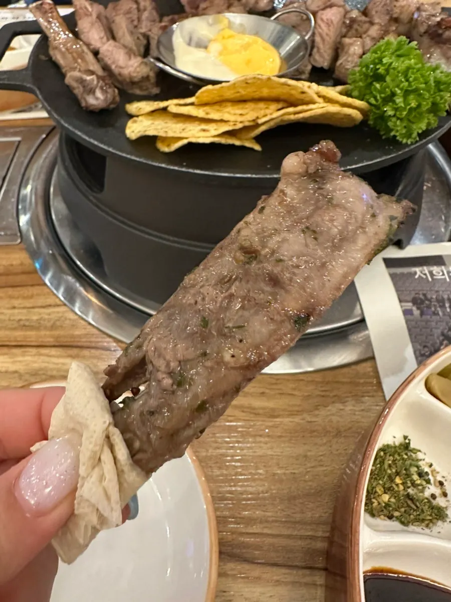 Shoulder rack grilled eaten with pickled lettuce stem