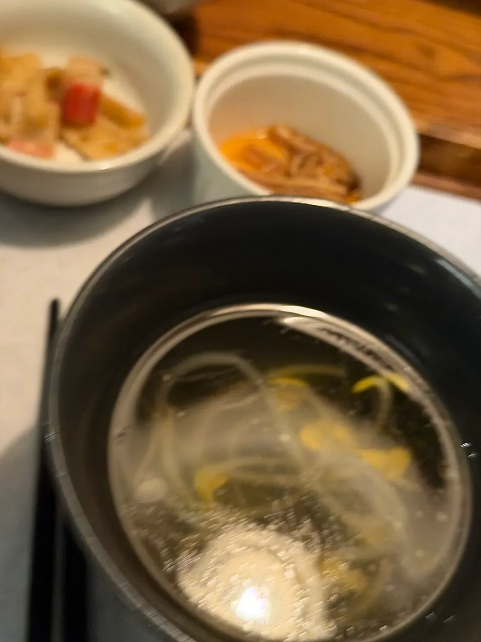Four banchan including kimchi, radish salad, and fish cake stir-fry