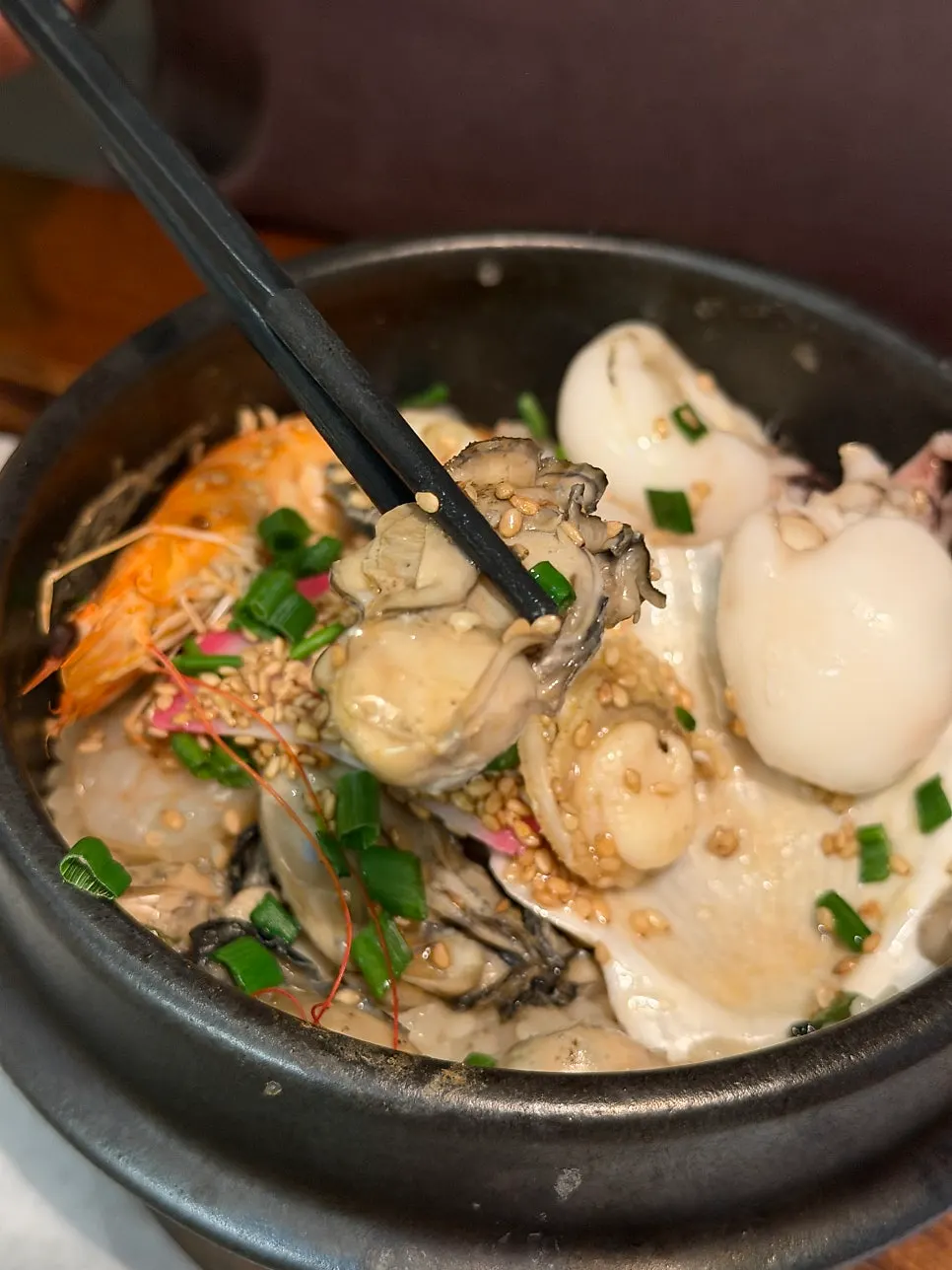 Seafood sotbap topped with large oysters