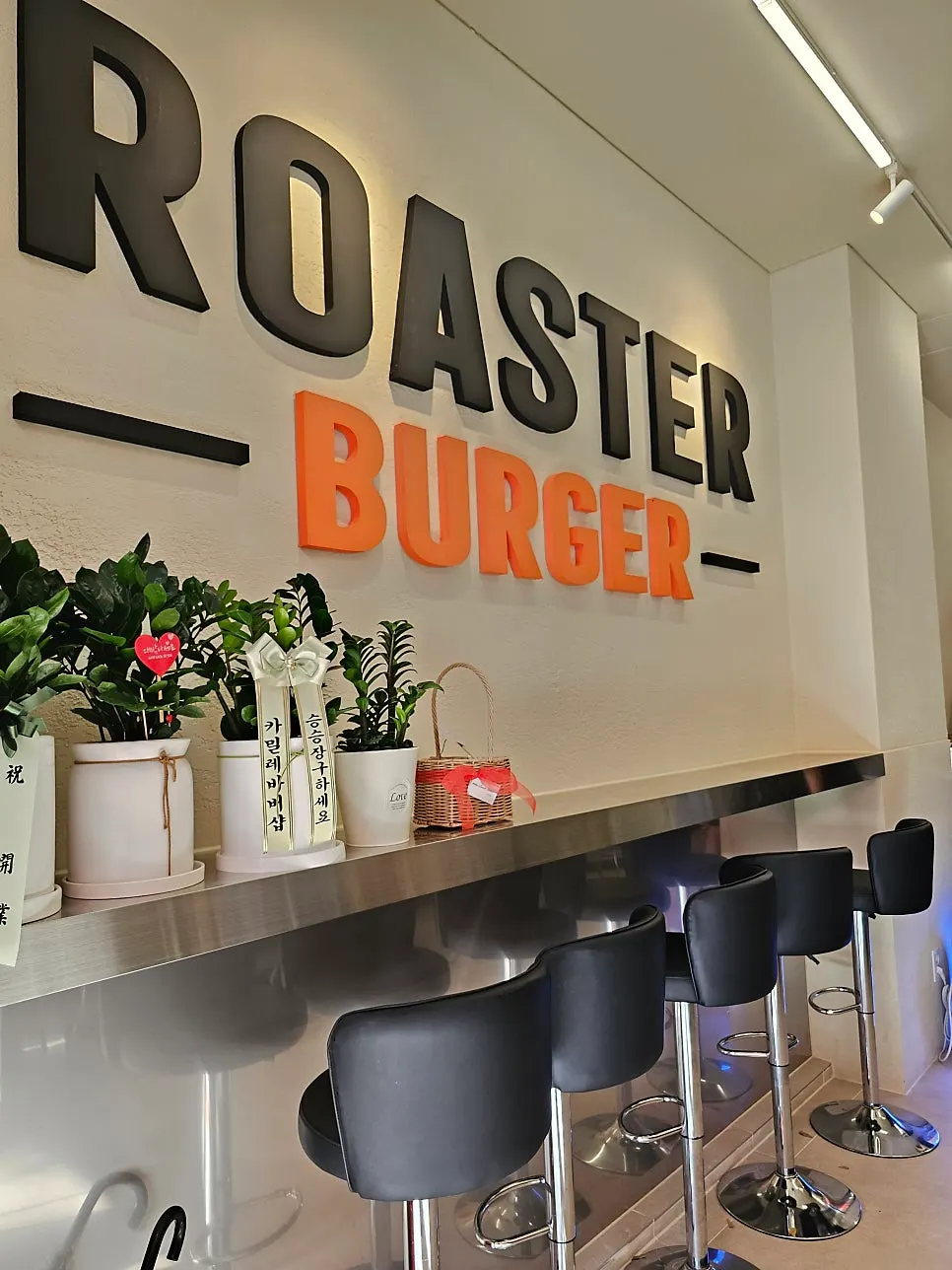 Interior tables and decor at Roaster Burger