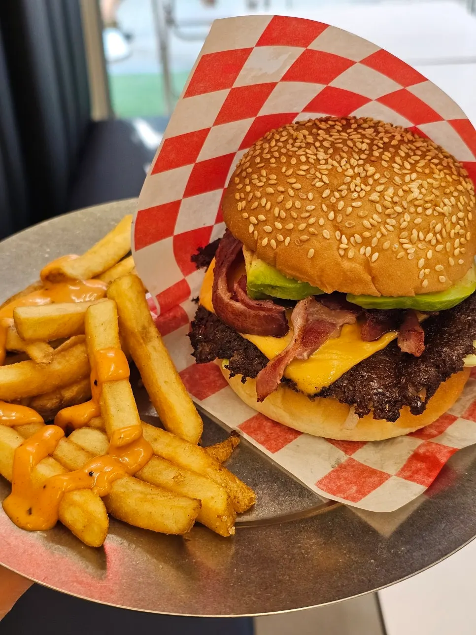 Plate of fries topped with sauce