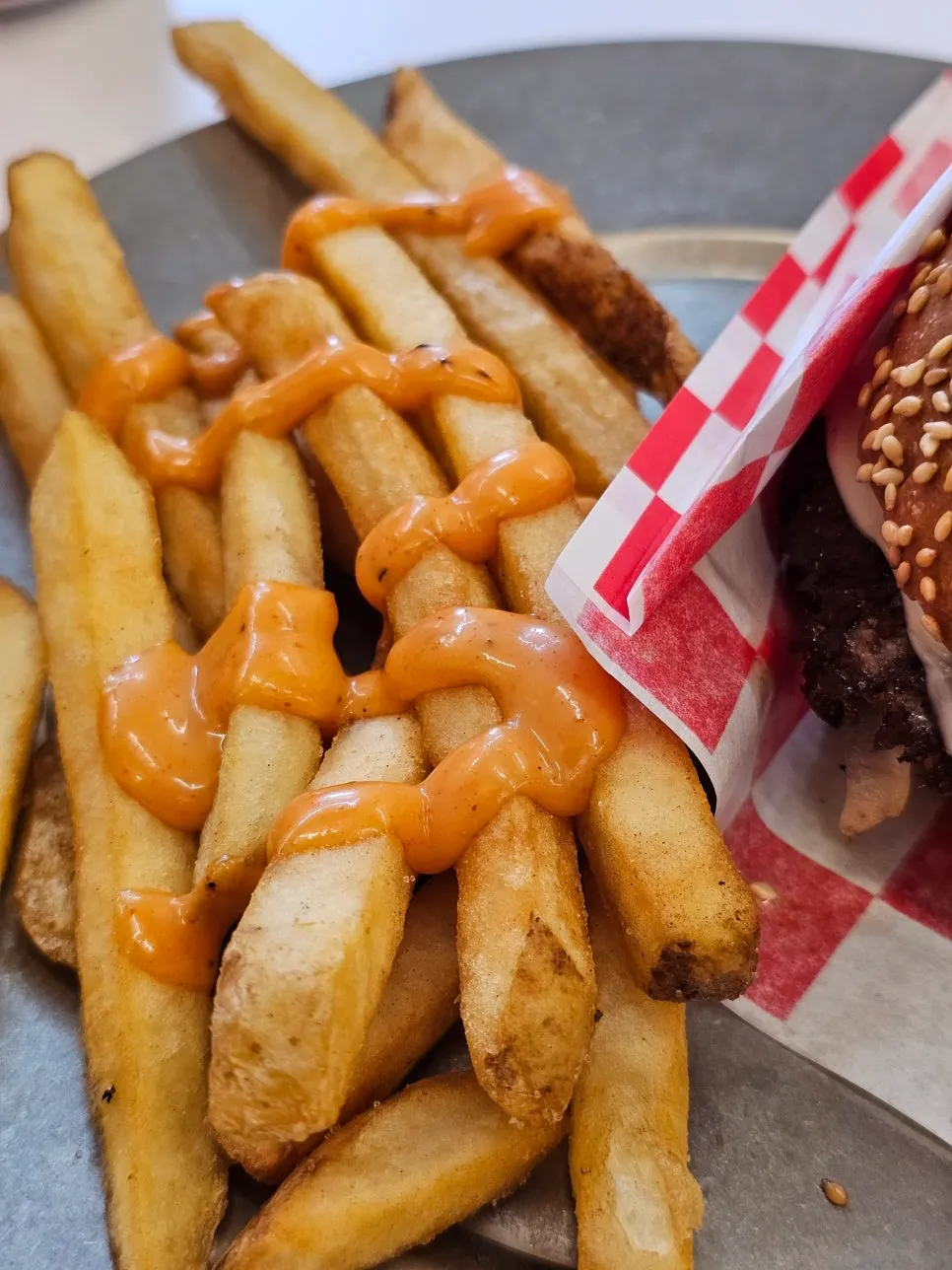 Fries eaten with spicy sauce
