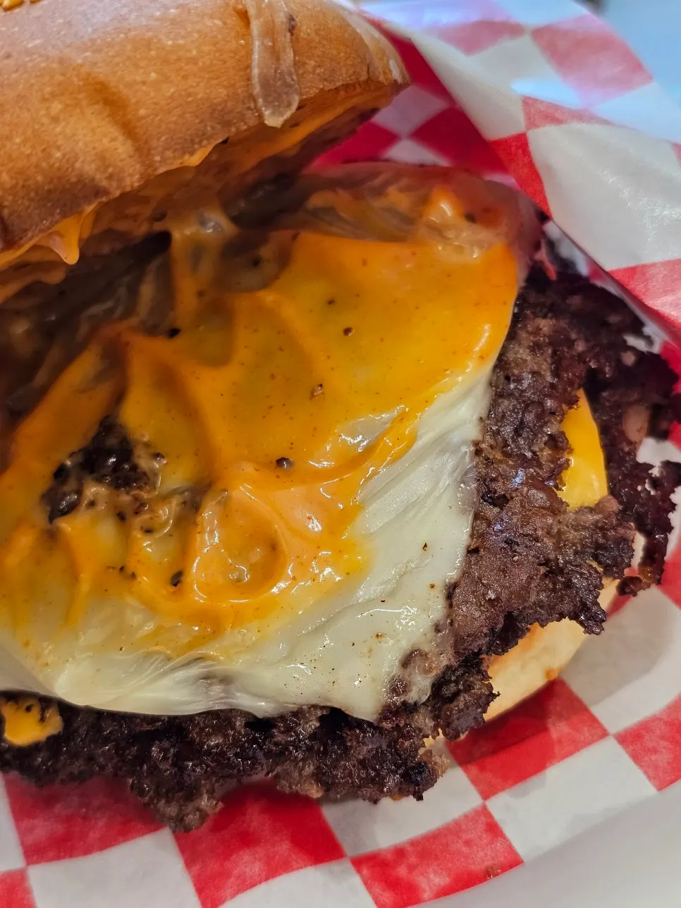 Cross-section of the double cheeseburger showing melted cheese layers