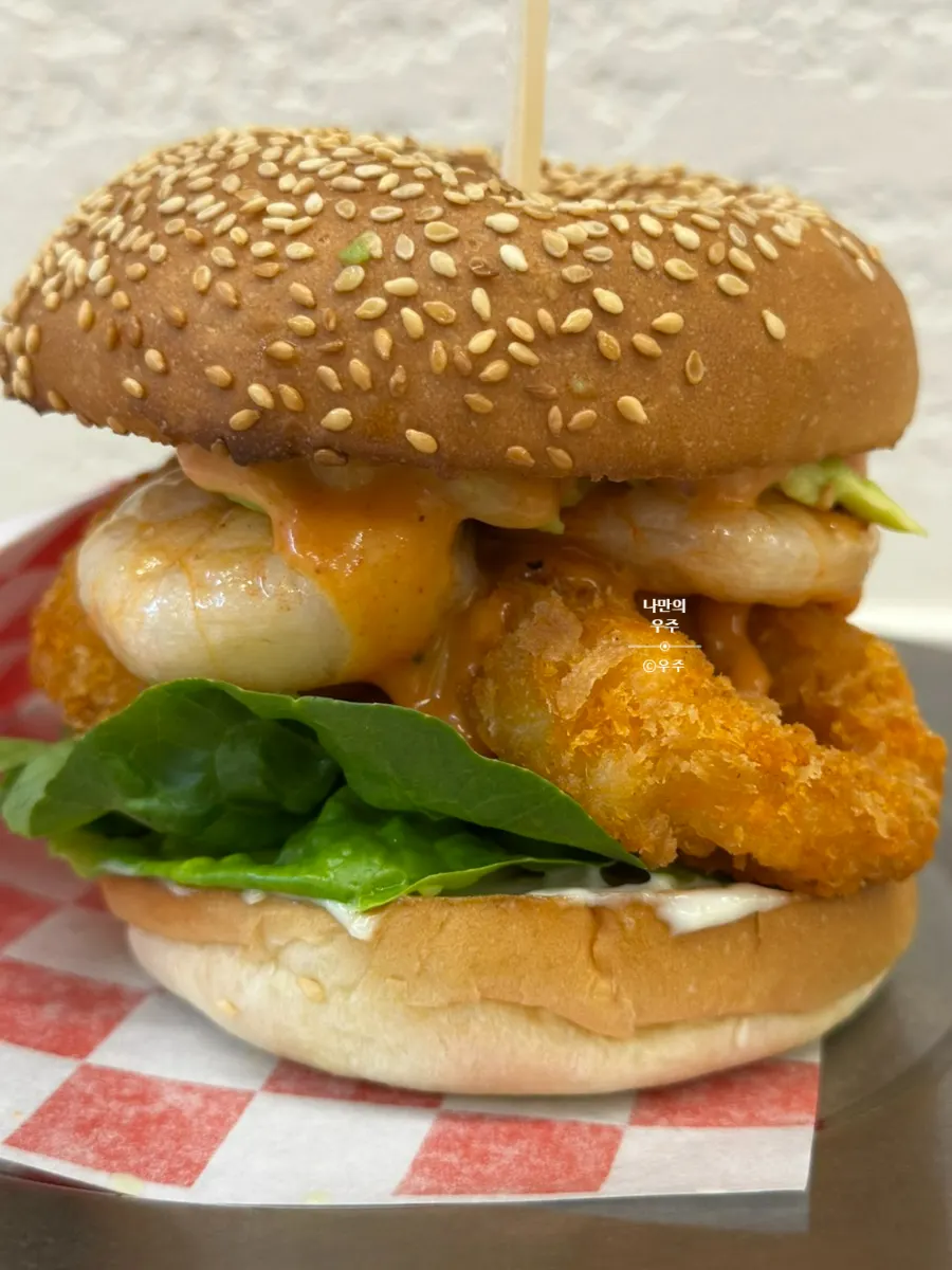 Cross-section of the burger showing whole shrimp and shrimp rings