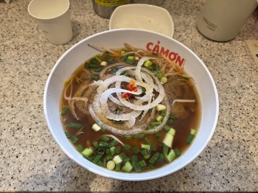 A pho meal set on the table at Kkamon Jeongja