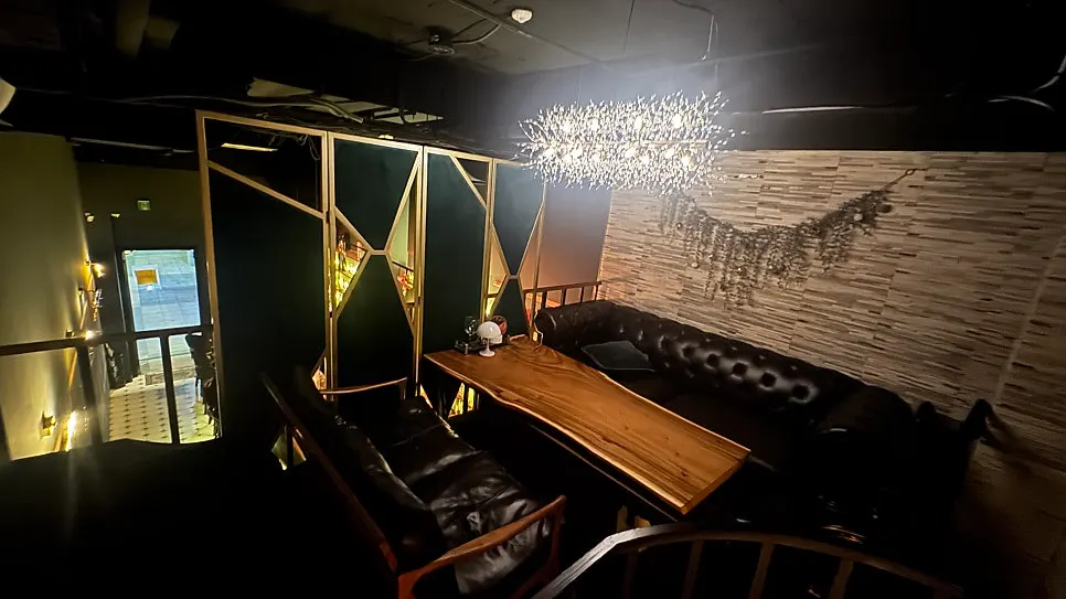 Bar area lined with whiskey bottles