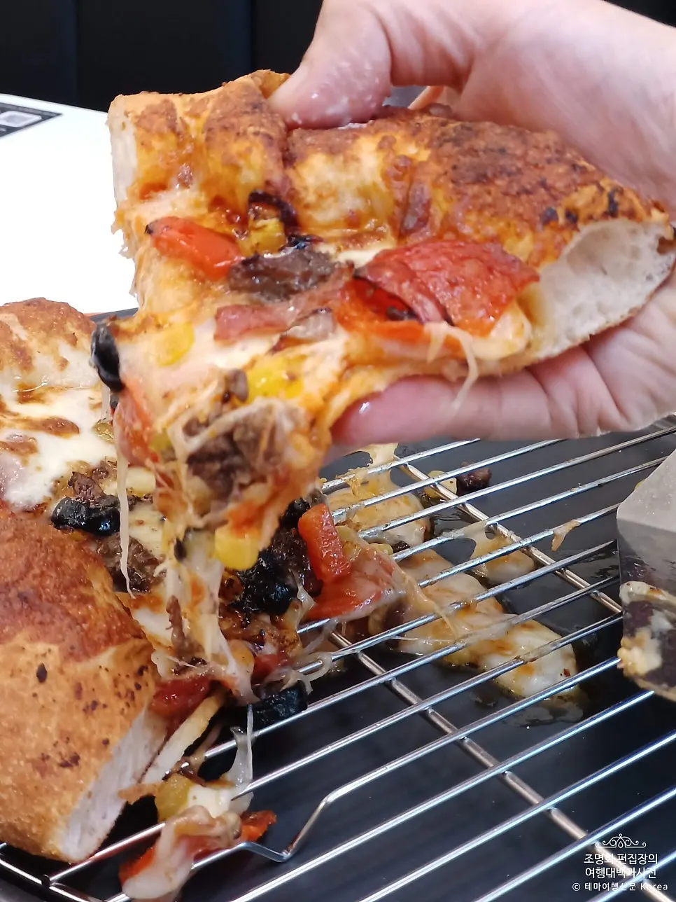 Overhead view of the topping-packed combination pizza