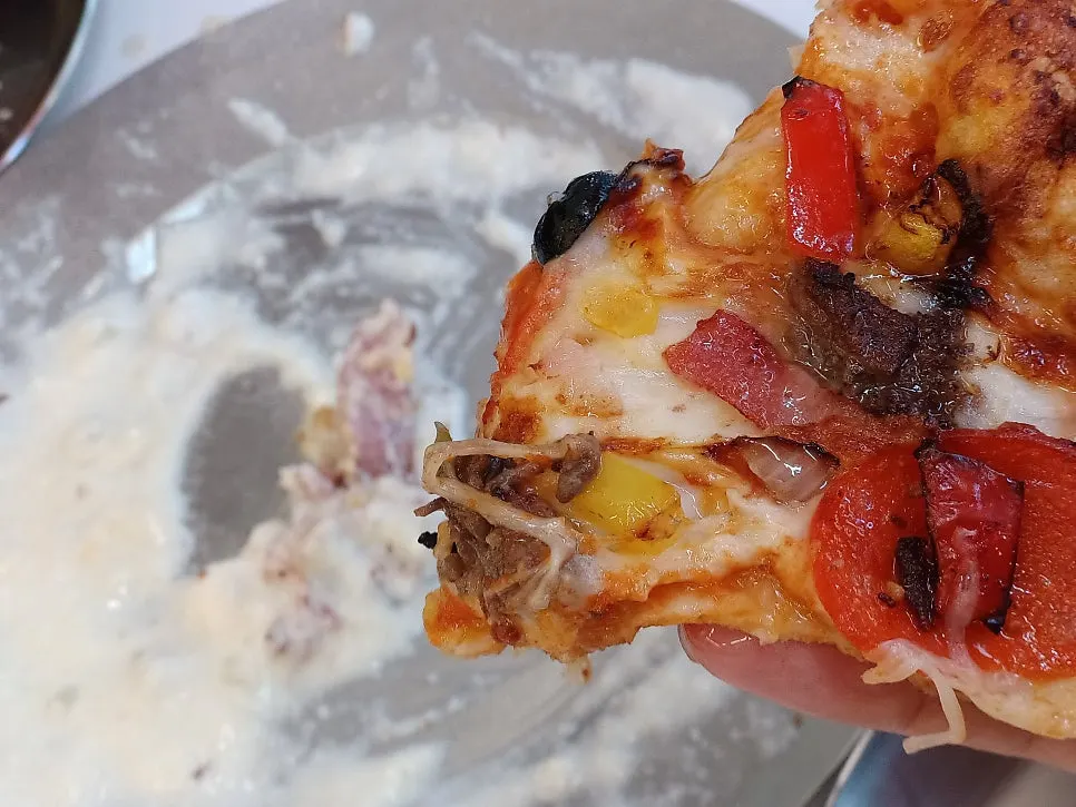 Combination pizza with one slice removed