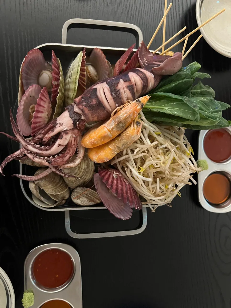 Bacha Badajjim topped with scallops and whole squid