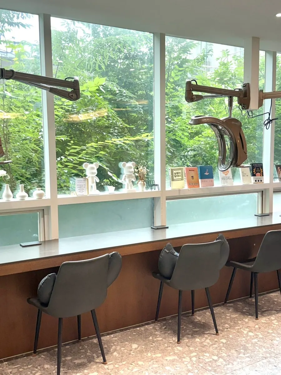 Hair salon interior with green decorations
