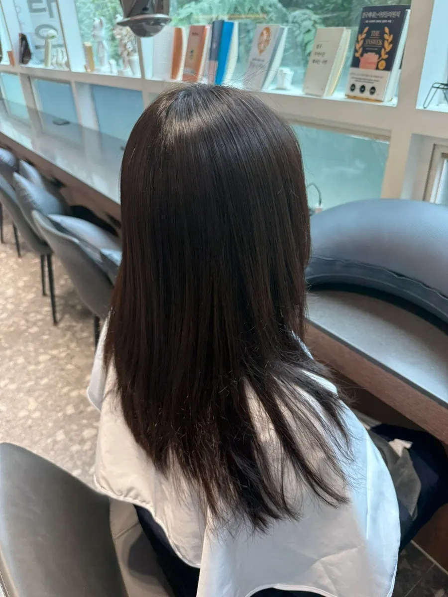 Hair smoothed with a flat iron before the perm
