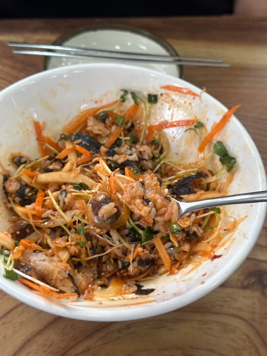 A spoonful of cockle bibimbap