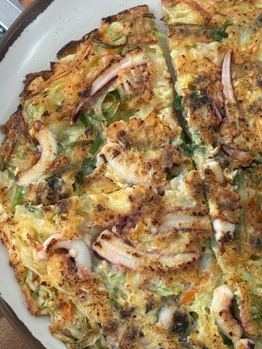 Large seafood pancake fresh off the pan