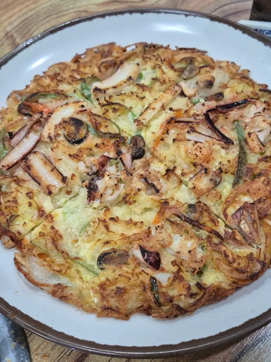 A full plate of seafood pancake at Jeongjeong-a Sikdang