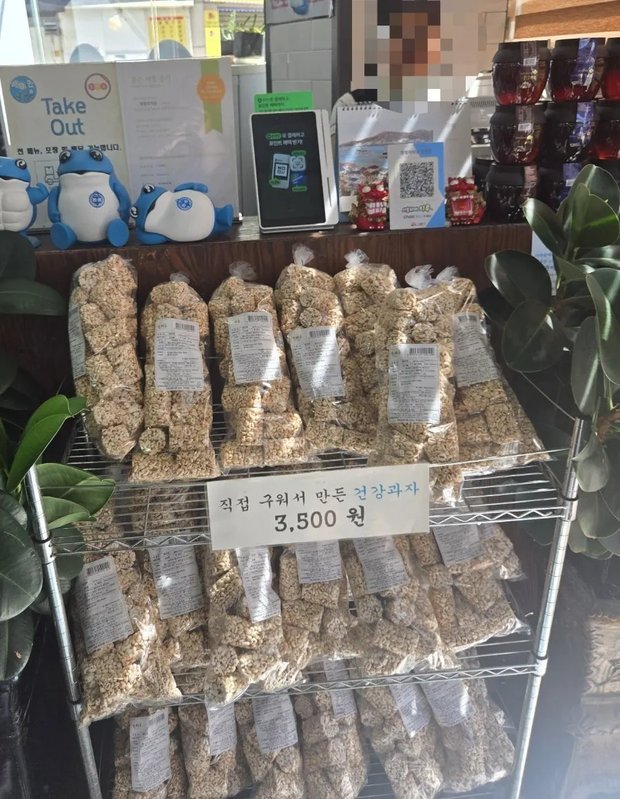 Display of homemade snacks and jocheong syrup near the counter