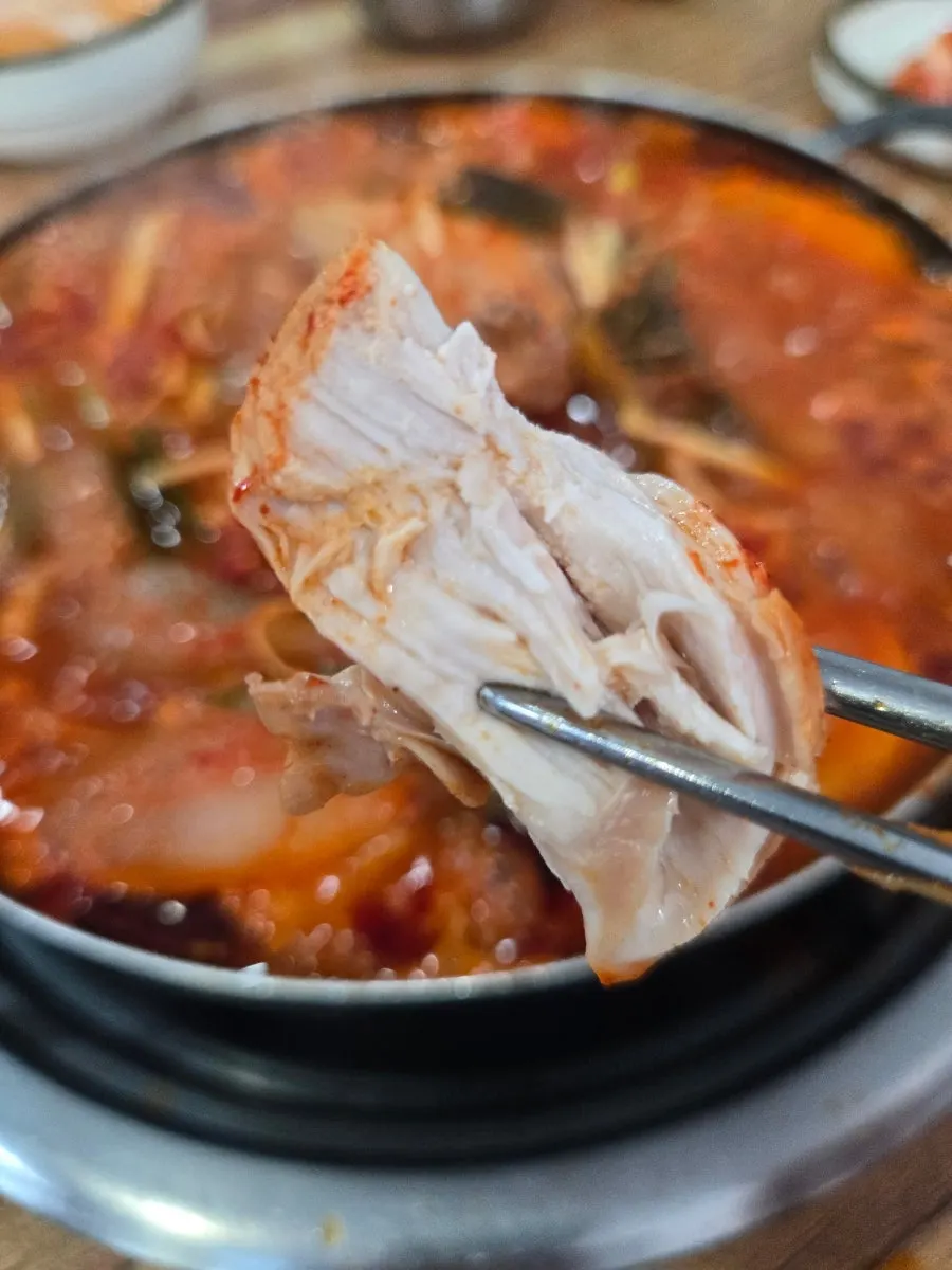 Chicken breast dipped into the reduced broth