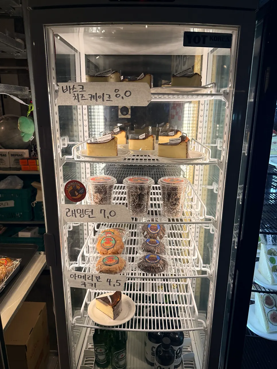 Café goods on display including mugs and t-shirts