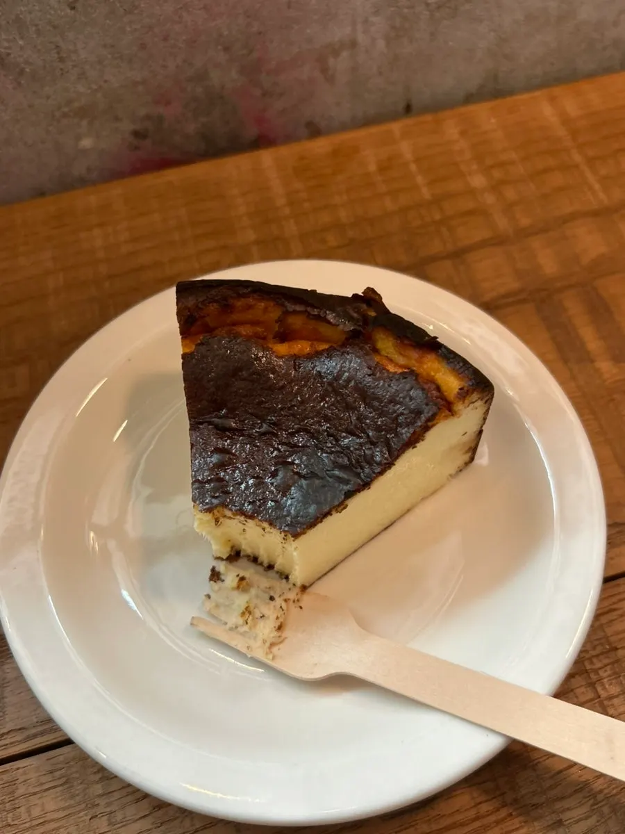 Cross-section of Basque cheesecake cut with a fork