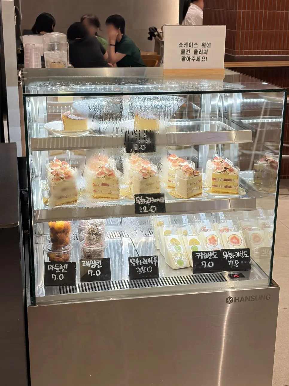 Menu board showing dark-roast coffee options