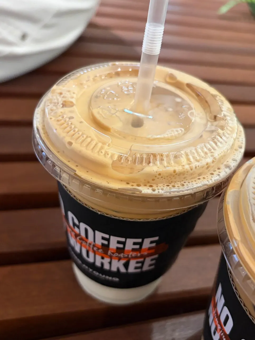 Iced caffè latte and coconut latte received as takeout