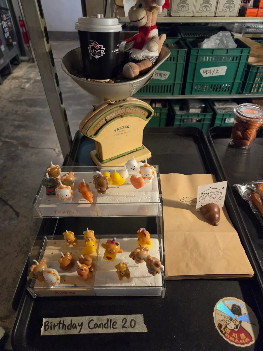 Goods corner with mugs, T-shirts and other café merchandise
