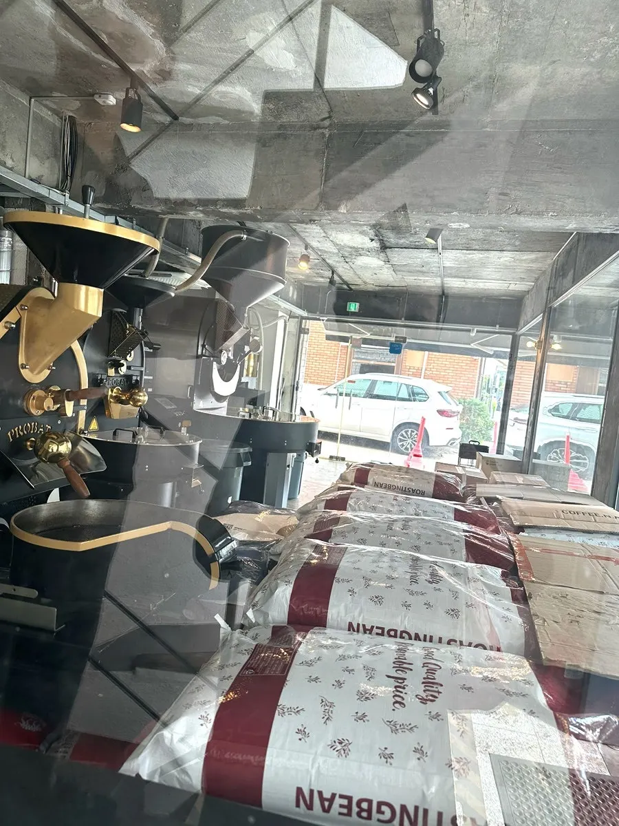 First-floor roasting space with bags of coffee beans