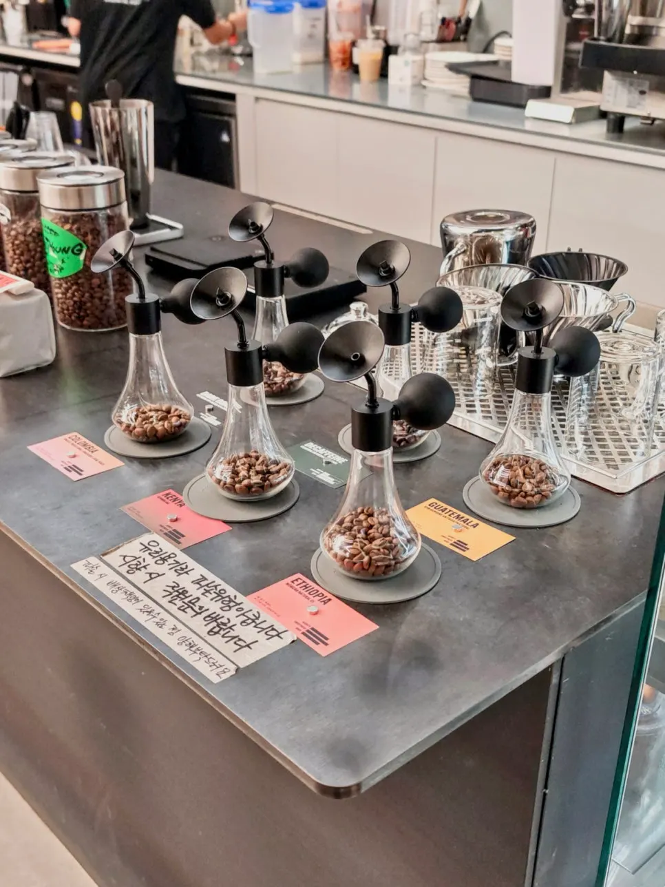 Display shelf of in-house roasted coffee beans for sale