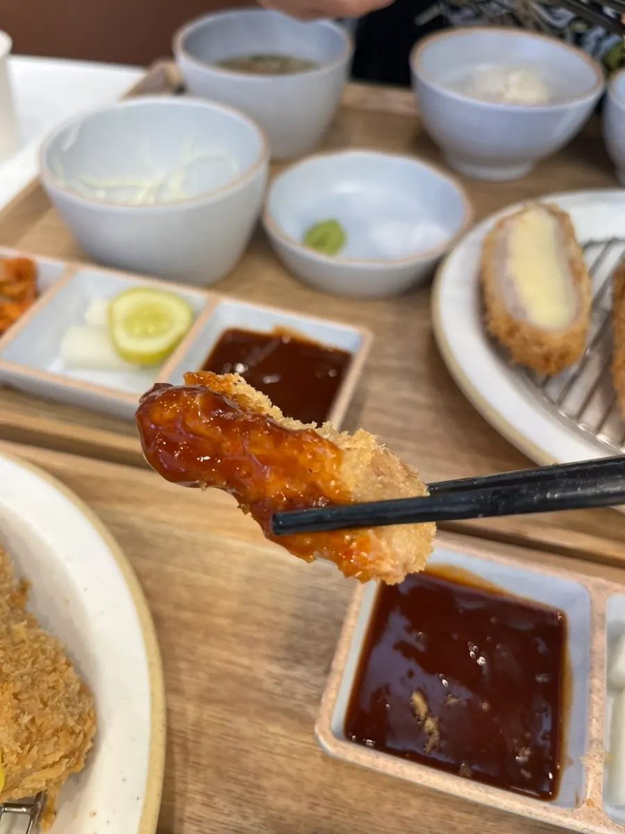 A piece of tonkatsu topped with wasabi