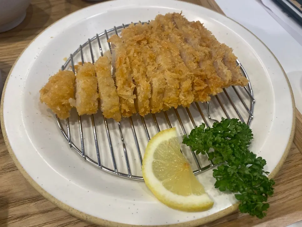 Close-up cross-section of thick special pork loin katsu
