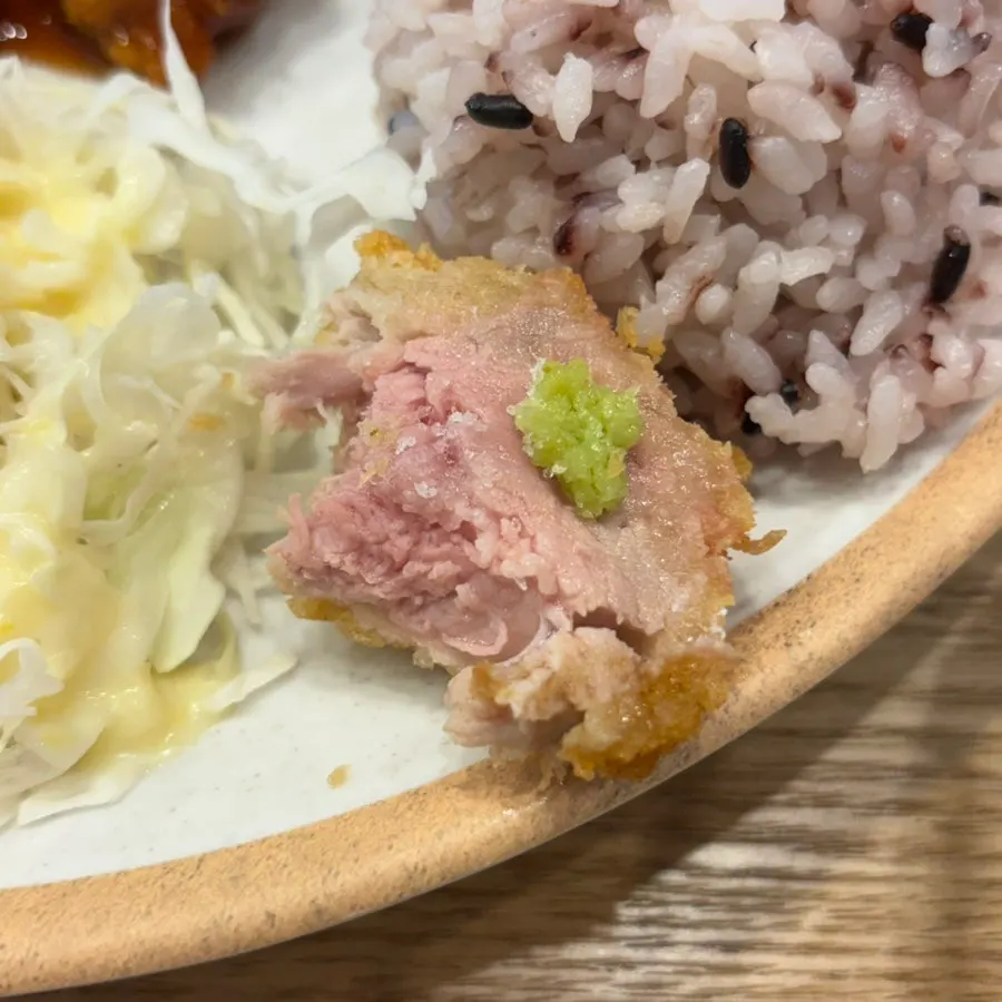 A piece of fillet katsu topped generously with wasabi