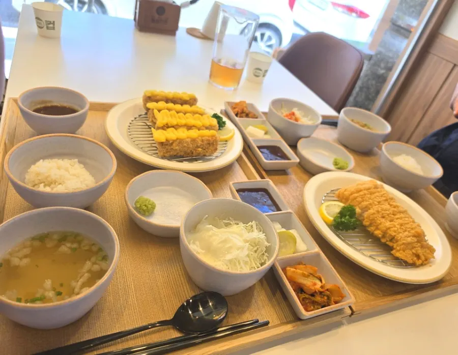 A golden fried tonkatsu meal spread