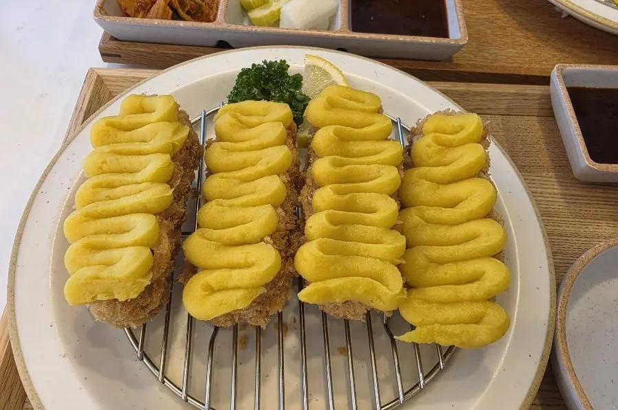 Cross-section of katsu filled with sweet potato mousse and cheese