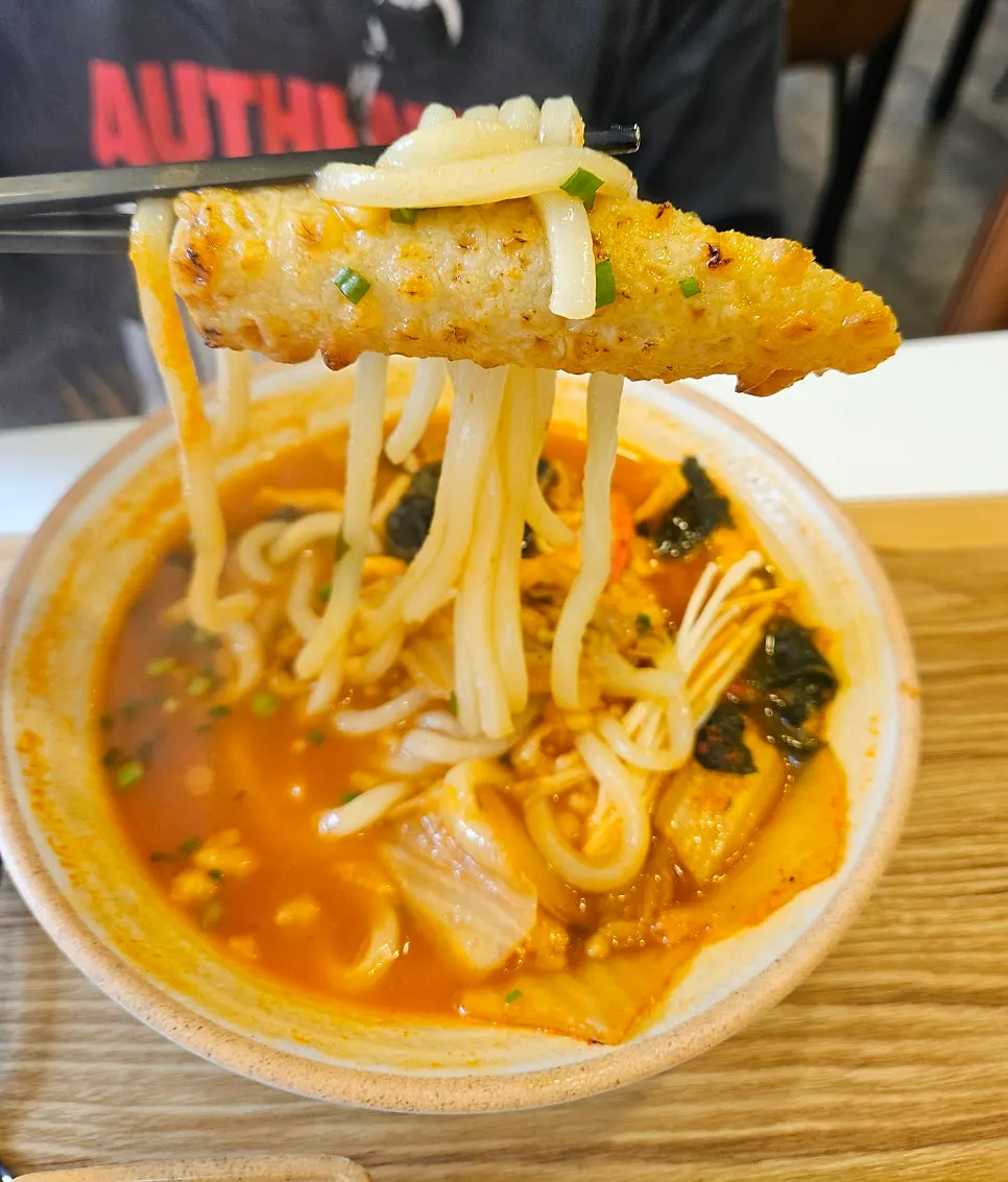 A bowl of Kimchi Fish Cake Udon
