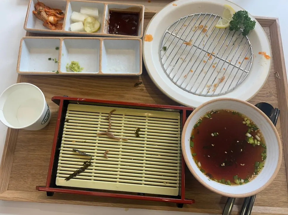 Nearly empty plates of kimchi cheese nabe and hire katsu set