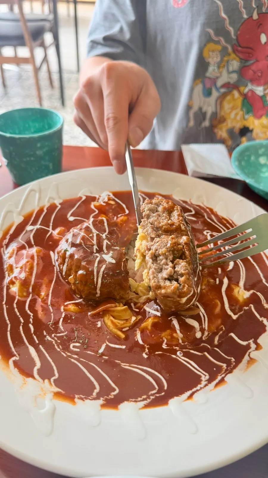 Handmade hamburg steak cut in half showing the juices